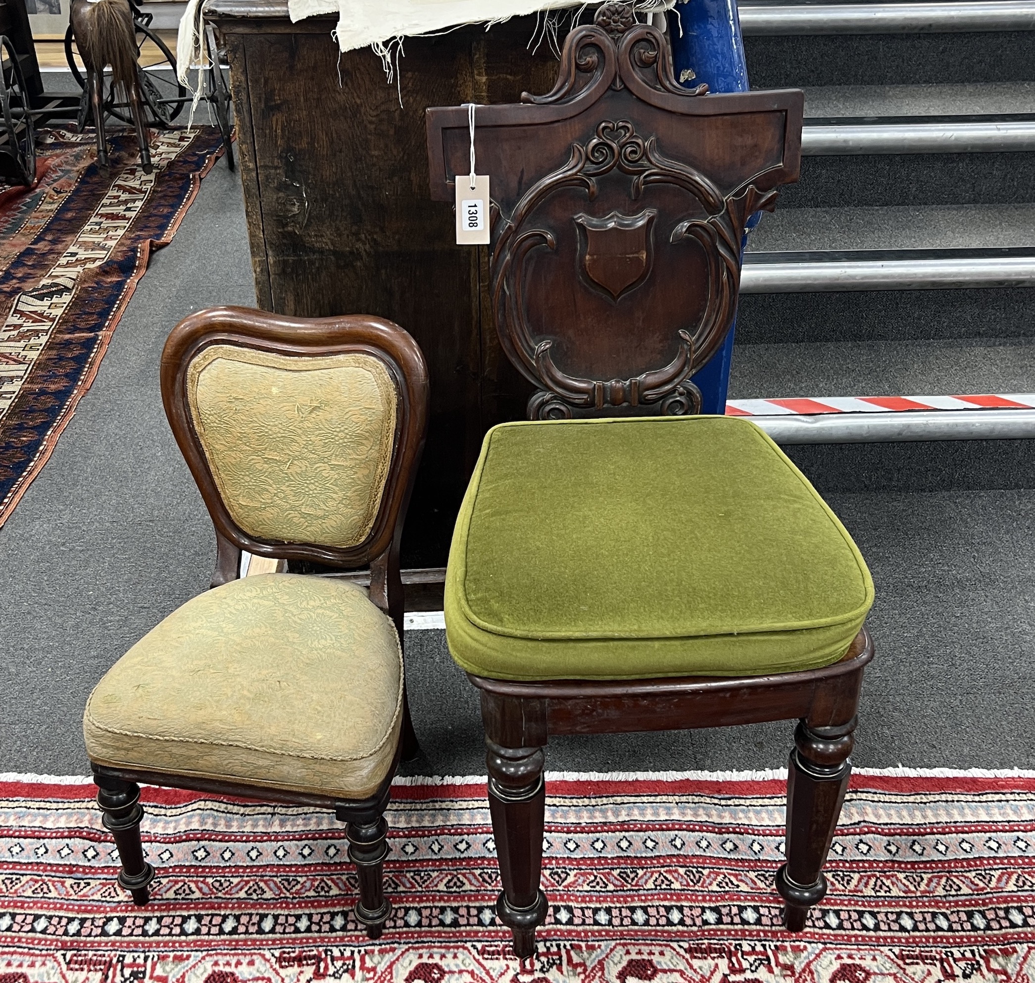 A Victorian carved mahogany hall chair and a Victorian mahogany child's chair